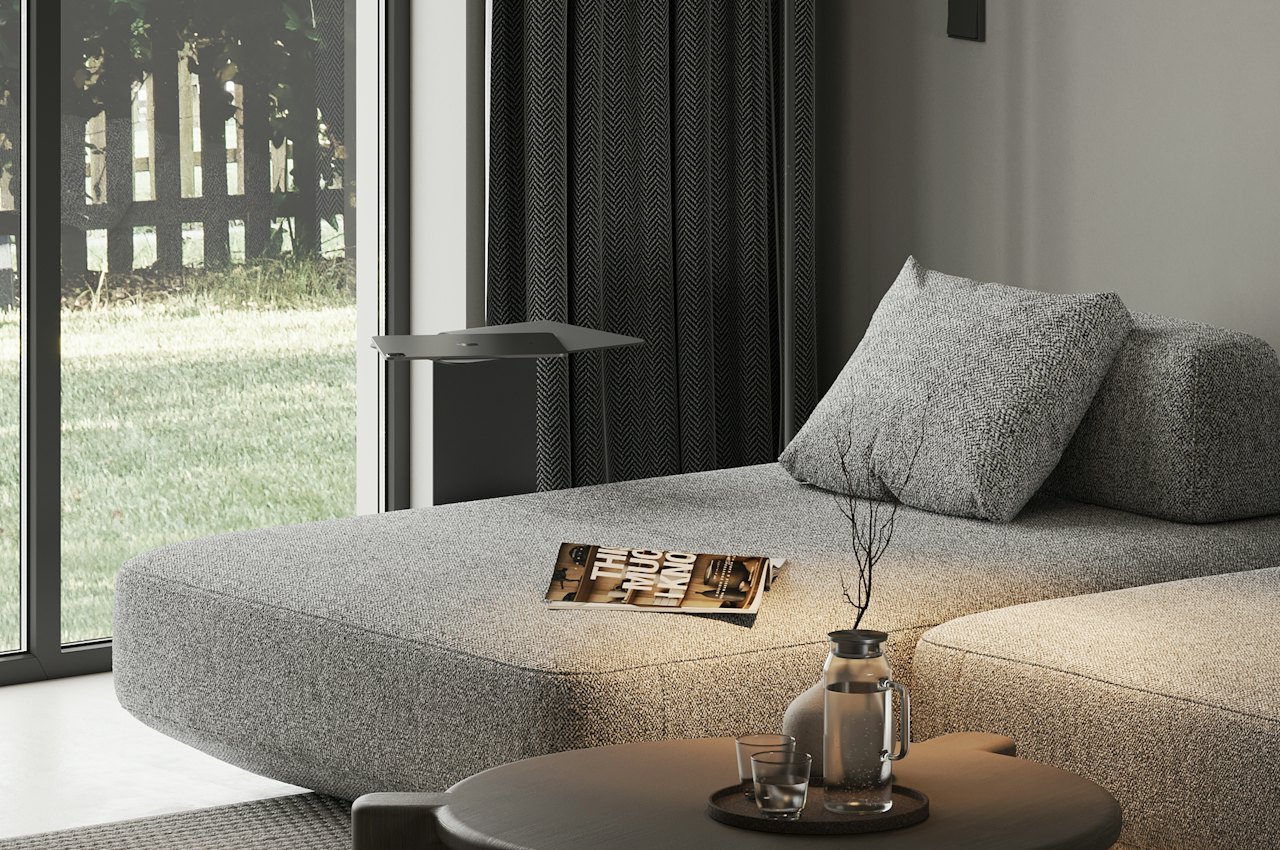Salon lumineux avec canapé et table basse devant une baie vitrée, pour bien choisir une table basse relevable